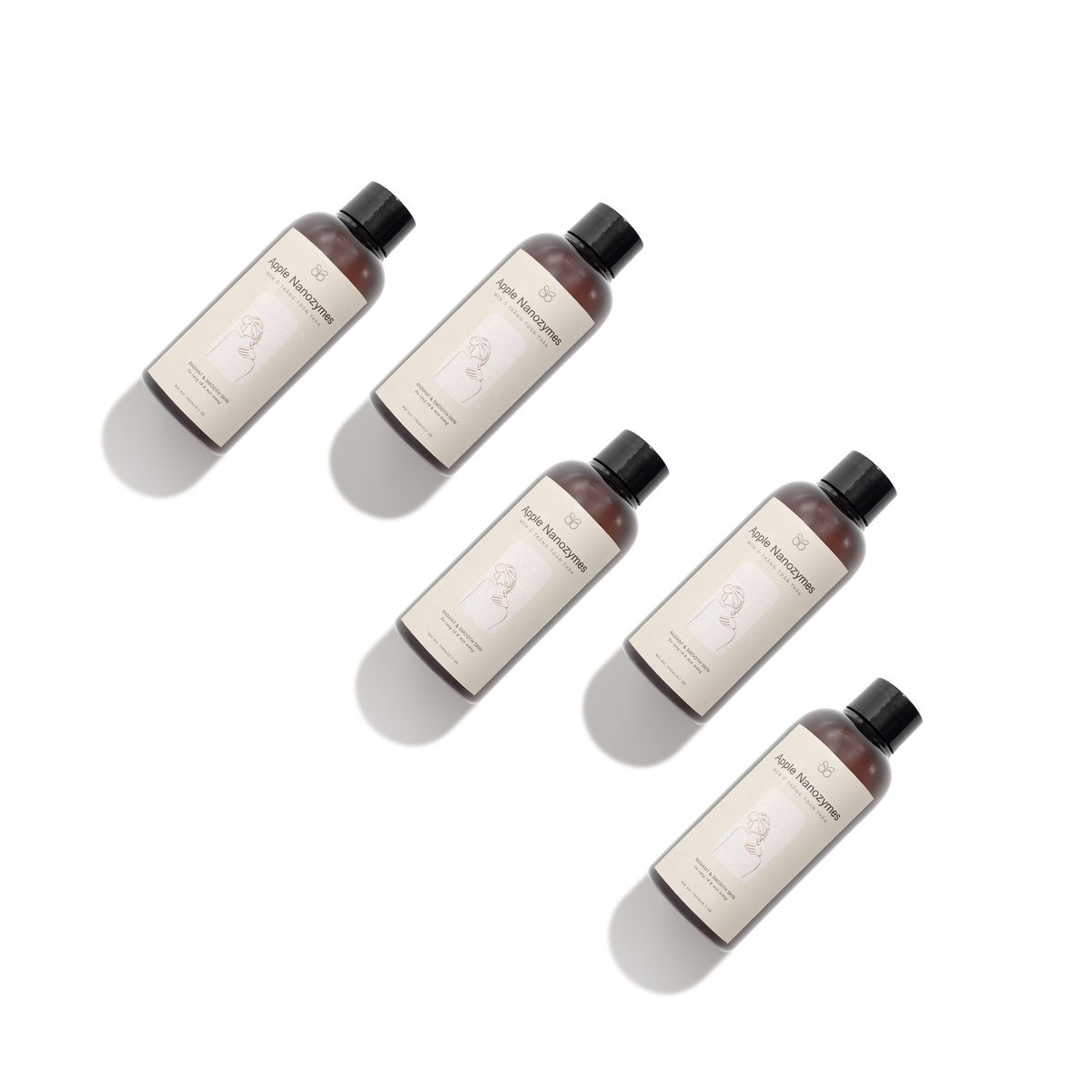 Ảnh concept năm chai toner xếp chéo đều nhau trên nền trắng, bóng đổ song song, chụp tại studio Juva Media